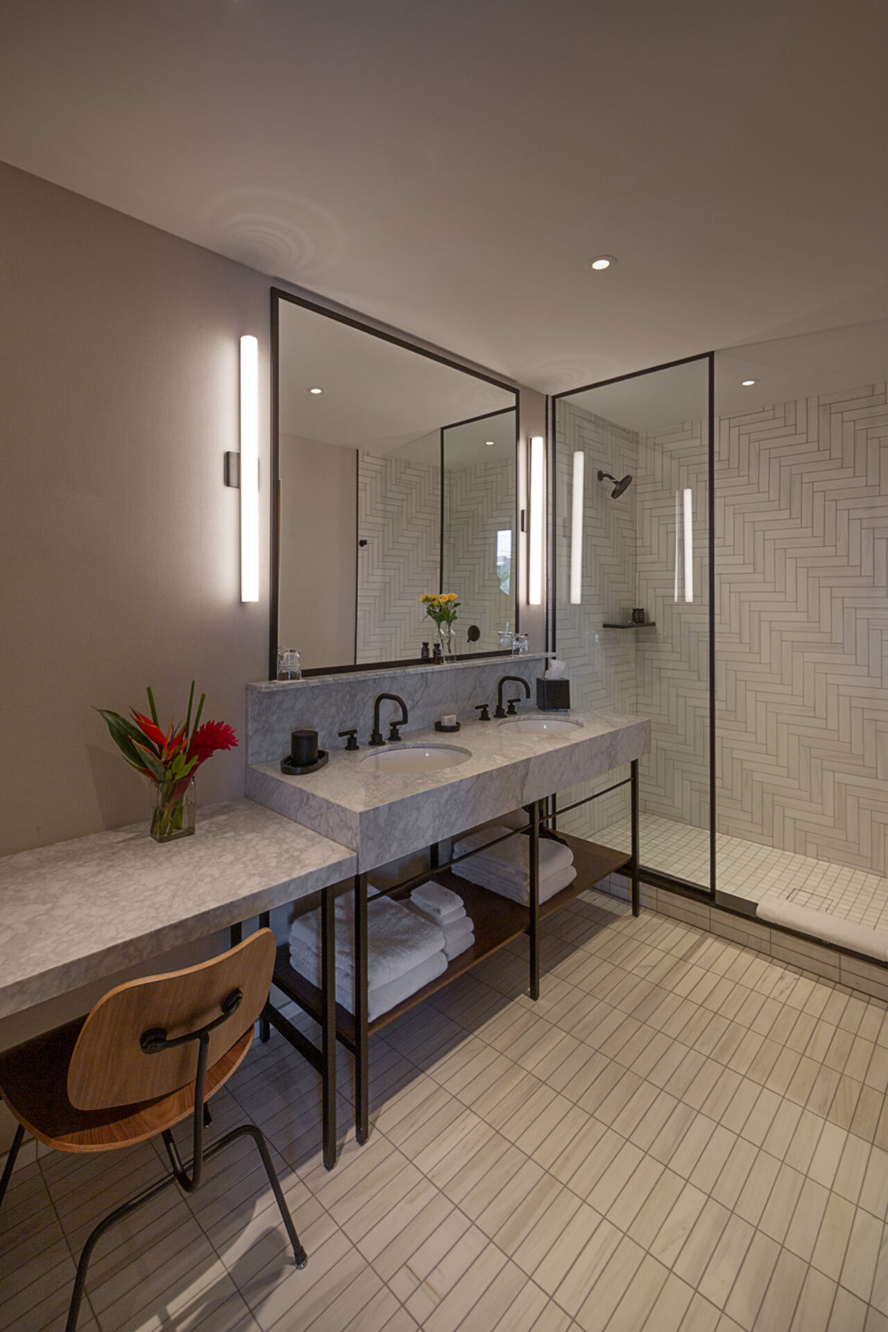 Seating, double vanity, and large glass shower at our hotel in Ybor City, FL