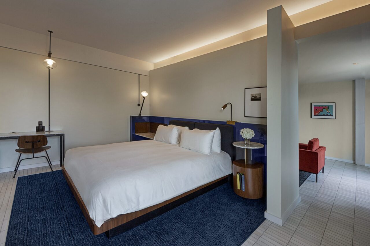 Large bed in a separated sleeping area of a spacious Ybor City hotel suite