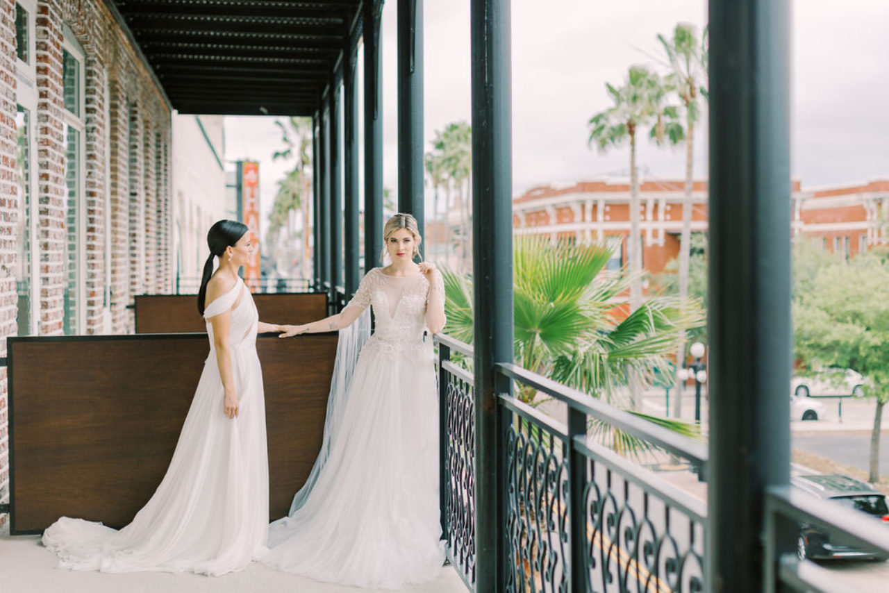 Two brides on the patio of Hotel Haya in Ybor City