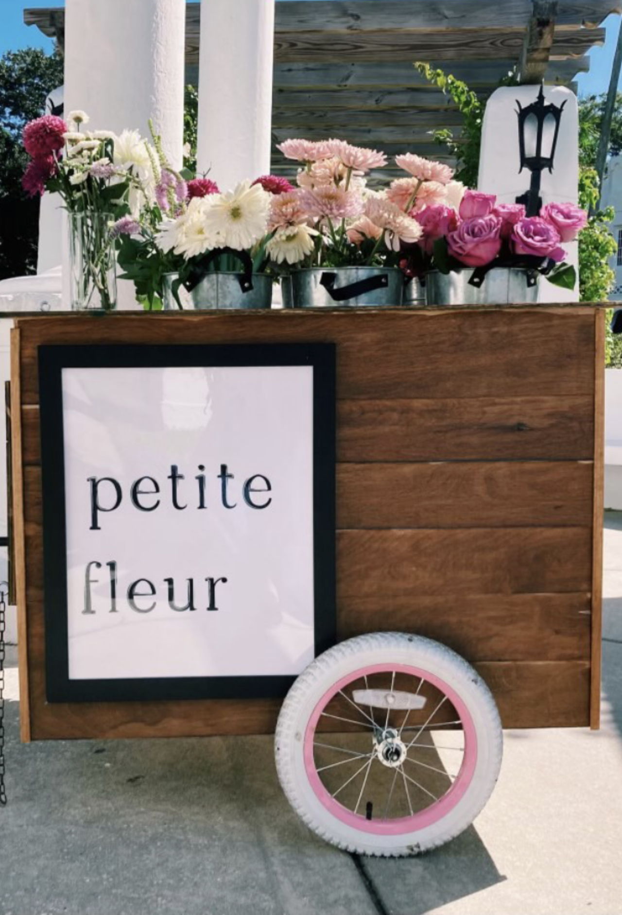 Petite Fleur at the Valentine's Brunch at Flor Fina with pink roses an flowers in a wooden cart