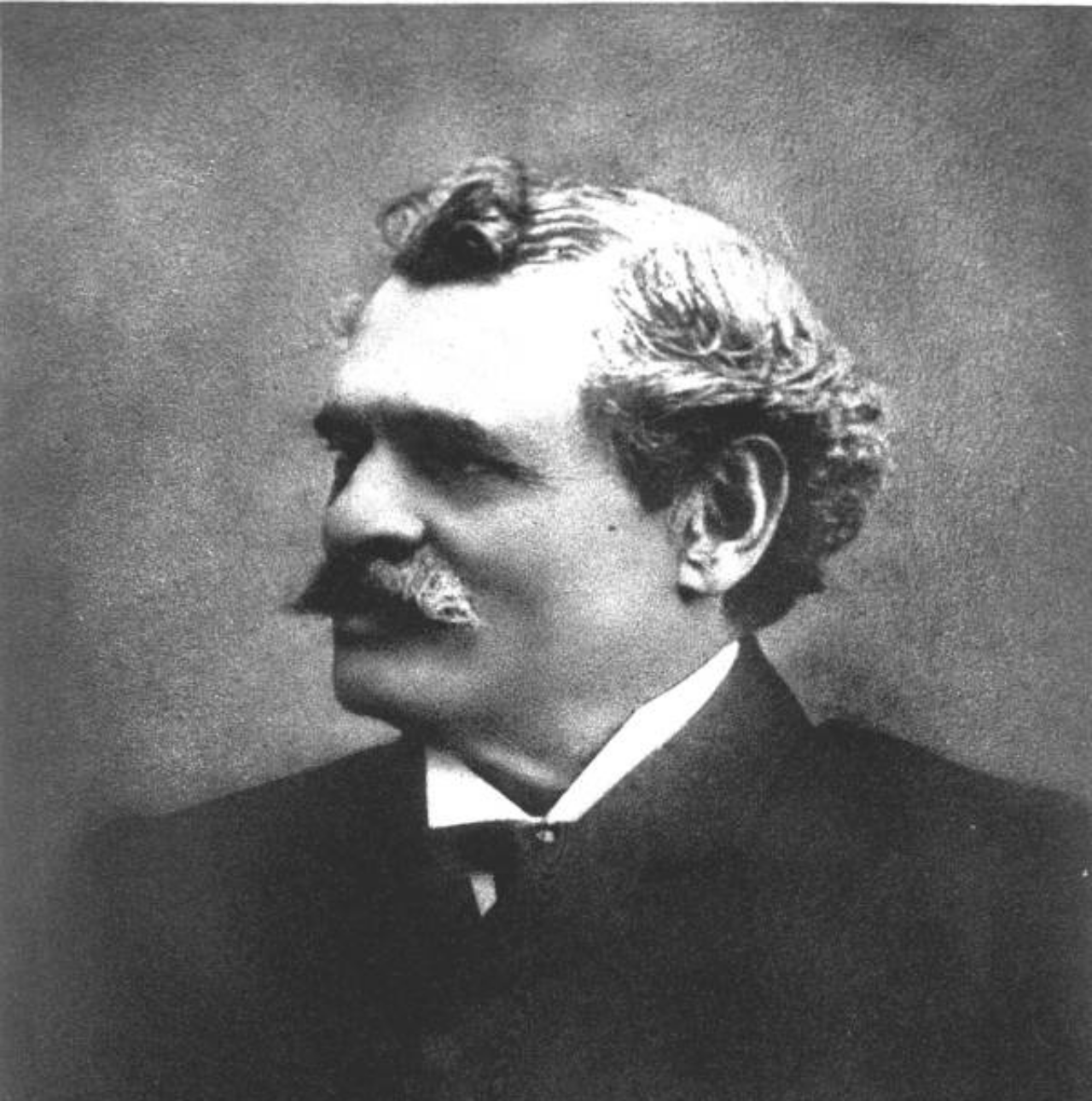 Vintage black and white photograph of a mustached man