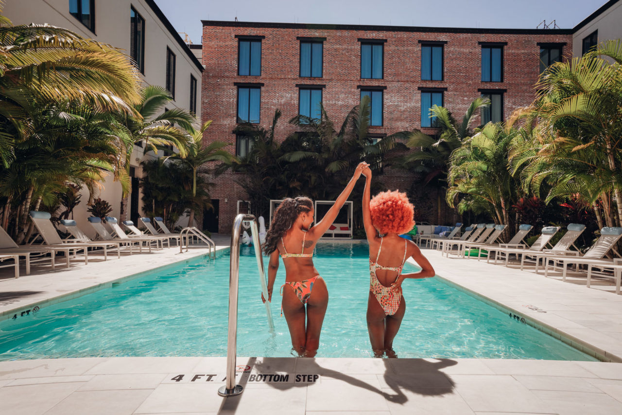 Two women in the water at our Tampa hotel with a pool bar